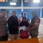 Caption : Giat pam Polsek Banjarwangi penyaluran BLT